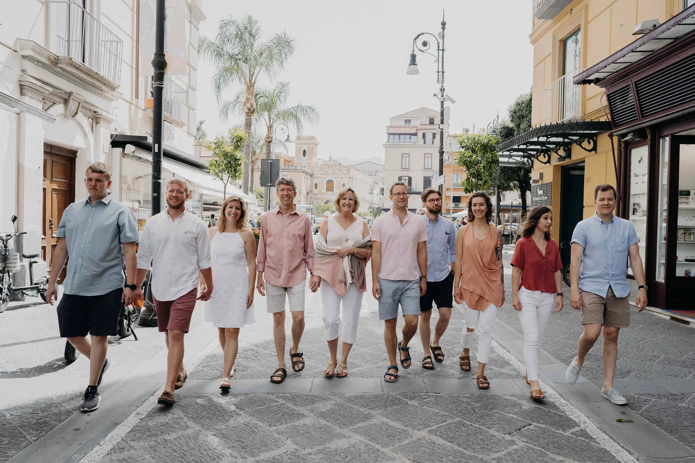 Group photoshoot in Sorrento Italy with family walking through town street