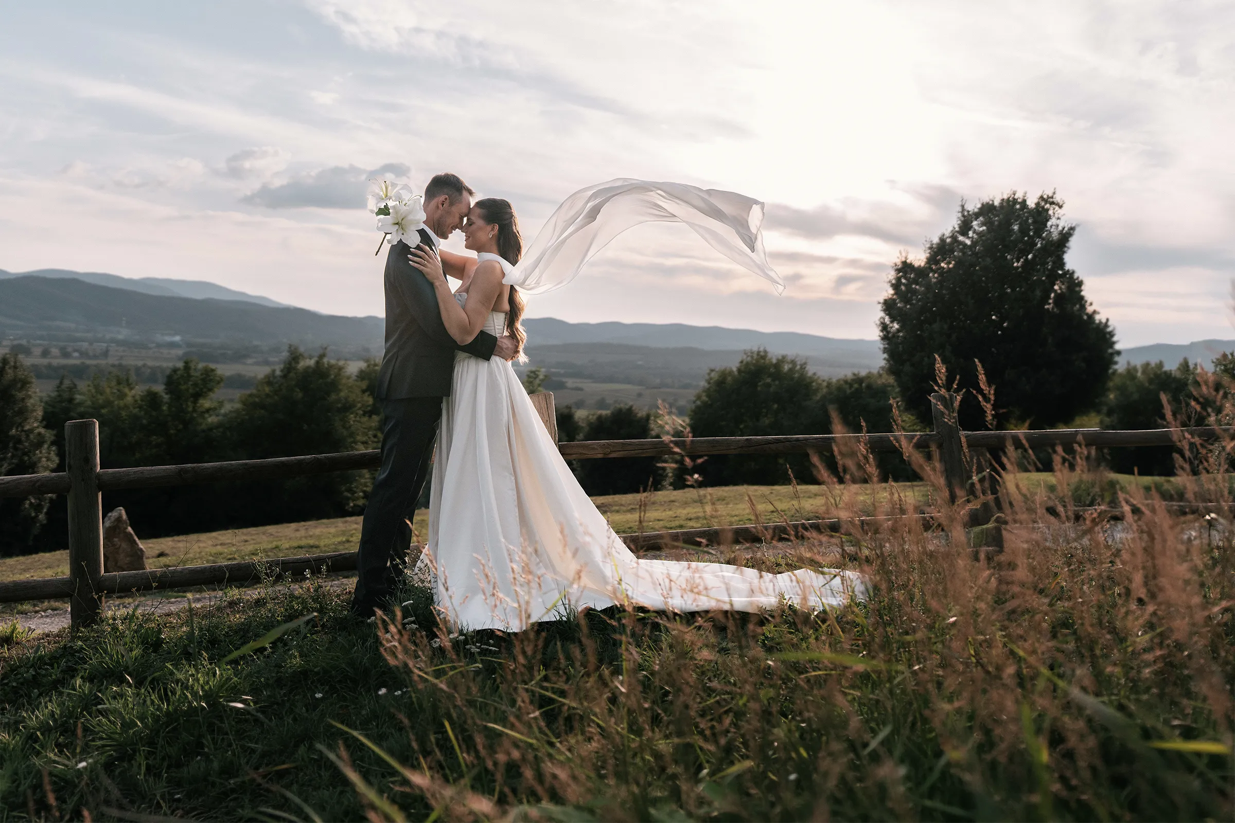 Romantic elopement in Tuscany countryside at sunset with bride and groom